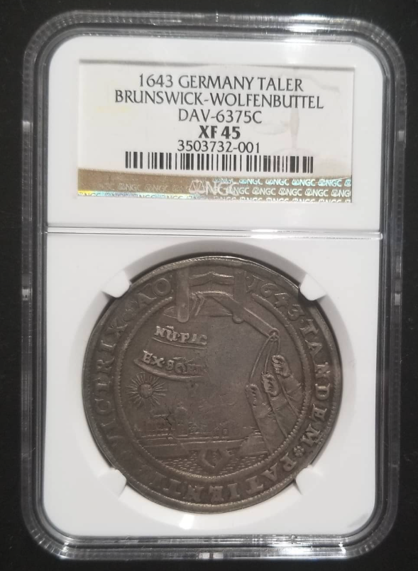 1643 AR Thaler (Glockenthaler / 'Bell Thaler') - Davenport-6375C - the seventh in the celebrated seven-type Bell Thaler series - obverse: crowned five-helmeted Brunswick arms / reverse: bell suspended from a wooden frame and rung by three hands emerging from clouds, view of the city of Wolfenbüttel in the distance, sun and tetragrammaton above, scroll inscribed NUPLC EX 9 ('Now after 9 [years]'), legend TANDEM PATIENTIA VICTRIX ('Patience is at last the Victor') with five-petaled flowers separating each word - obverse